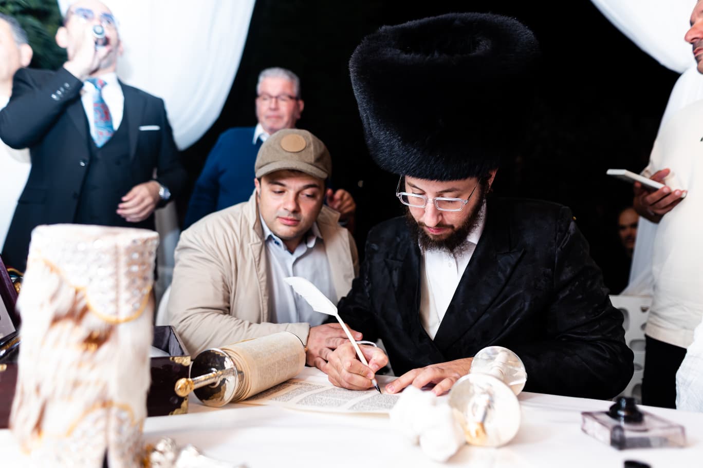 Avraham Gavrielov writing a Torah scroll
